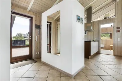 a large kitchen with a large white wall at BL852-Saltum-Revlingevej-14 in Saltum