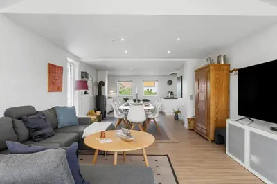 a living room with a couch and a table at BL509-Blokhus-Jens-Baerentsvej-7 in Blokhus