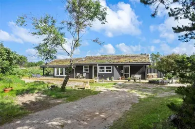 a small house with a grass roof at BL450-Saltum-Graabakken-8 in Saltum