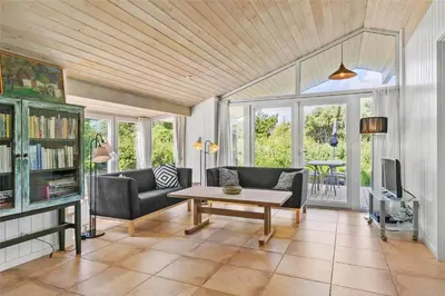 a living room with a couch and a table at BL450-Saltum-Graabakken-8 in Saltum