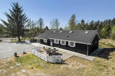 an overhead view of a black house with a deck at BL1588-Pandrup-Lunen-88 in Pandrup