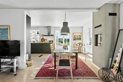 a kitchen and dining room with a dining table and a dining room at BL327-Blokhus-Sonder-I-By-23 in Blokhus