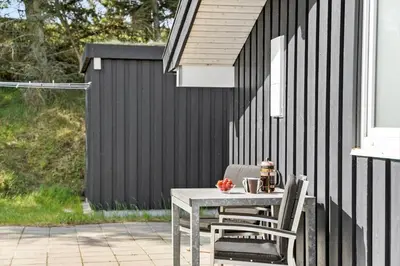 a table and chairs sitting on a patio at BL1428-Saltum-Karen-Mariesvej-31-D in Saltum