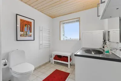 a white bathroom with a toilet and a sink at BL757-Saltum-Tolhoj-12 in Saltum