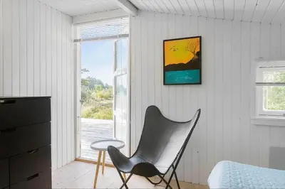 a black chair in a room with a window at BL1589-Saltum-Bondagervej-52 in Saltum