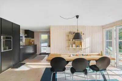 a kitchen with a table and chairs in a room at BL1589-Saltum-Bondagervej-52 in Saltum