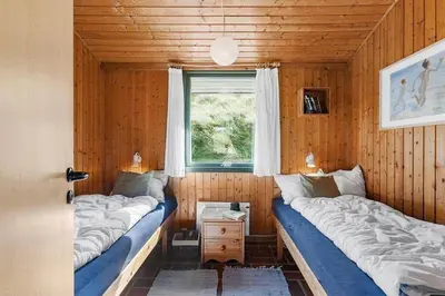 two beds in a small room with a window at BL1308-Saltum-Kordalsvej-124 in Saltum