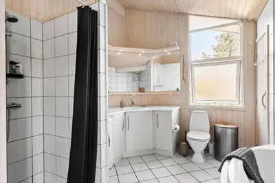 a bathroom with a sink and a toilet at BL1461-Saltum-Kvansletten-29 in Saltum