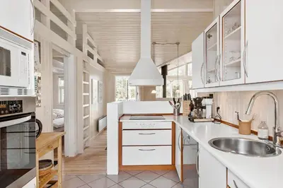 a kitchen with white cabinets and a sink at BL1461-Saltum-Kvansletten-29 in Saltum