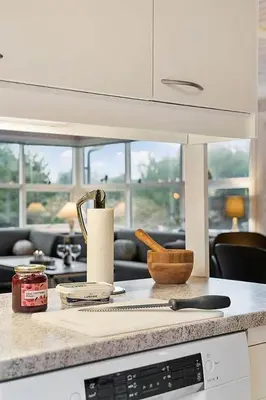 a kitchen with a counter top with a knife at BL1451-Blokhus-Quintusvej-5 in Blokhus