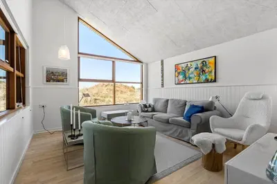 a living room with a couch and a table at BL980-Saltum-Faarup-Klitvej-46 in Saltum