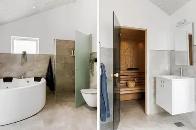 a bathroom with a tub and a sink and a toilet at BL1481-Saltum-Kommenvej-1 in Saltum
