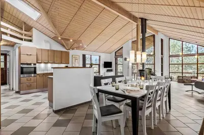 a kitchen and dining room with a table and chairs at BL308-Saltum-Laustvej-24 in Saltum