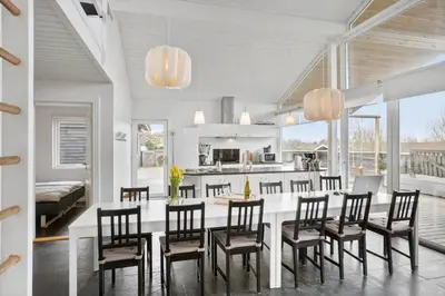 a kitchen and dining room with a table and chairs at BL106-Saltum-Tolhoj-2 in Saltum