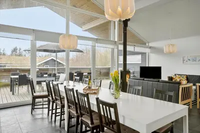 a dining room with a white table and chairs at BL106-Saltum-Tolhoj-2 in Saltum