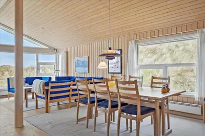 a dining room with a table and chairs at BL1772-Saltum-Faarup-Klitvej-22 in Saltum