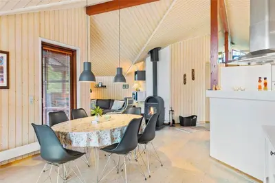 a dining room with a table and chairs at BL160-Blokhus-Bag-Hojen-68 in Blokhus