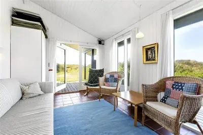 a living room with a couch and chairs and a table at BL745-Saltum-Karen-Mariesvej-70 in Saltum