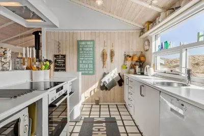 a kitchen with white counters and a sink at BL1047-Saltum-Bag-Havstokken-2-A in Saltum