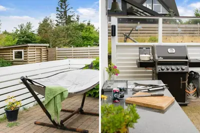 a patio with a grill and a table at BL1318-Blokhus-Vesterhavsbakken-28 in Blokhus
