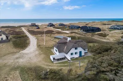 an aerial view of a house on the beach at BL1449-Blokhus-Kienersvej-8 in Blokhus