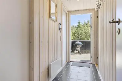 a hallway with a door leading to a yard at BL1066-Pandrup-Rodhus-Skolevej-17 in Pandrup