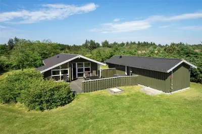 a small green house with a large yard at BL1625-Saltum-Fladen-Grund-8 in Saltum