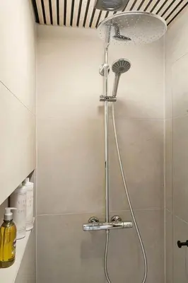 a shower with a shower head in a bathroom at BL1502-Blokhus-Graevlingevej-3 in Blokhus