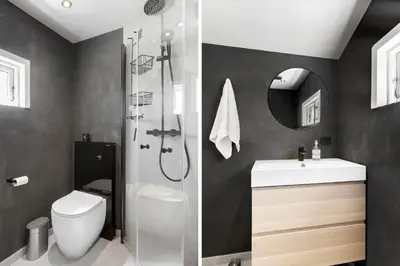 a bathroom with a shower and a toilet and a sink at BL1496-Blokhus-Peder-Madsensvej-28 in Blokhus
