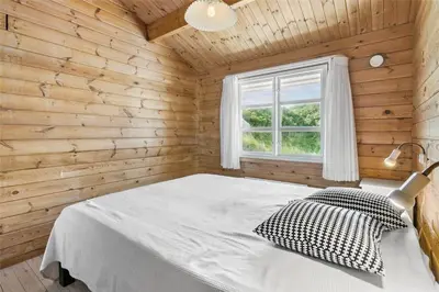 a bedroom with a white bed and a window at BL1665-Saltum-Borgvej-57 in Saltum