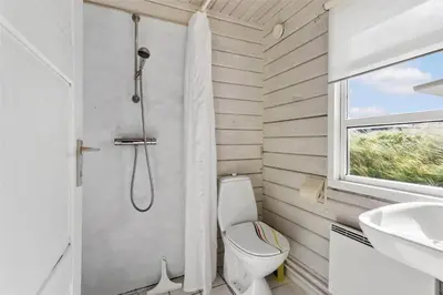 a bathroom with a shower and a toilet and a sink at BL1665-Saltum-Borgvej-57 in Saltum