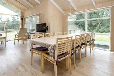 a large dining room with a large table and chairs at BL481-Pandrup-Rodhusparken-10 in Pandrup