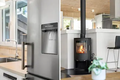 a kitchen with a stove with a fire in it at BL714-Saltum-Ornebjergvej-24 in Saltum