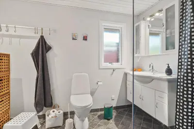a bathroom with a toilet and a sink at BL1682-Pandrup-Rodhus-Skolevej-24 in Pandrup