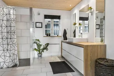a bathroom with a sink and a shower at BL964-Blokhus-Klitvejen-28 in Blokhus