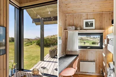a tiny house with a kitchen and a large window at BL1755-Saltum-Karen-Mariesvej-57 in Saltum