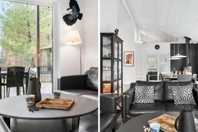 a living room with a couch and a table at BL1266-Pandrup-Rodhusparken-58 in Pandrup