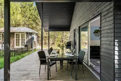 a patio with a table and chairs on it at BL1266-Pandrup-Rodhusparken-58 in Pandrup