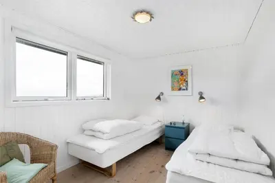 a bedroom with two beds and a window at BL216-Saltum-Svendborgvej-25 in Saltum