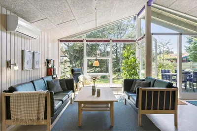 a living room with two couches and a table at BL609-Pandrup-Rodhus-Skolevej-10 in Pandrup