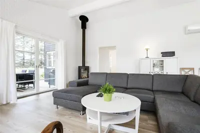 a living room with a couch and a table at BL386-Saltum-Nordvestvej-13 in Saltum