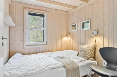 a bedroom with a white bed and a window at BL1227-Saltum-Porsevej-31 in Saltum