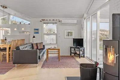 a living room with a couch and a table at BL1770-Saltum-Klittornvej-5 in Saltum