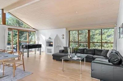 a living room with a couch and a table at BL1718-Blokhus-Ronliensvej-16 in Blokhus