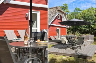 a patio with an umbrella and a table and chairs at BL238-Pandrup-Fyrregangen-18 in Pandrup