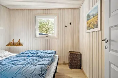 a bedroom with a bed and a window at BL1361-Saltum-Jaerens-Rev-Sydvest-8 in Saltum