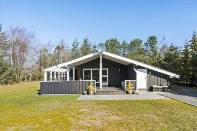 a black and white building with a grass yard at BL1361-Saltum-Jaerens-Rev-Sydvest-8 in Saltum