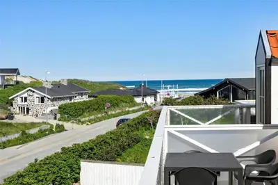 a view of the ocean from the balcony of a house at BL1584-Blokhus-Strandvejen-14-Lejl-4 in Blokhus