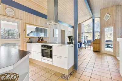 a kitchen with white cabinets and a counter top at BL1720-Saltum-Kvansletten-27 in Saltum