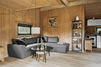 a living room with a couch and a table at BL1714-Saltum-Lyngsletten-11 in Saltum